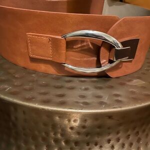 Tan belt with silver buckle and elastic back waist